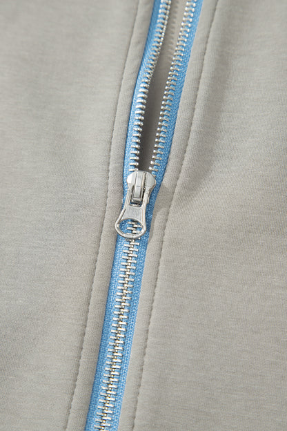 Ensemble 2 pièces jupe-short mini à cordon, veste zippée sport vert fumée à bord contrastant